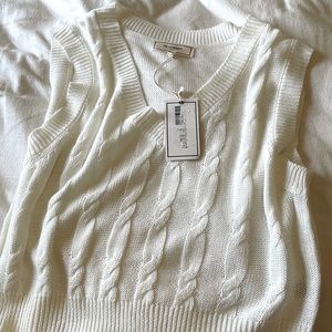 Crème colored cropped sweater.